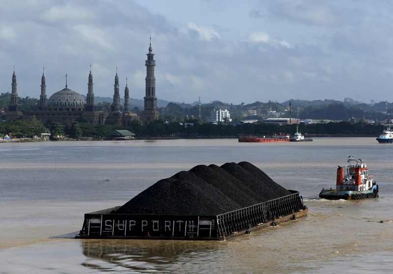A tug boat pulls a coal barge along the Mahakam River in Samarinda, East Kalimantan province, Indonesia March 2, 2016. u00e2u20acu201d Reuters pic