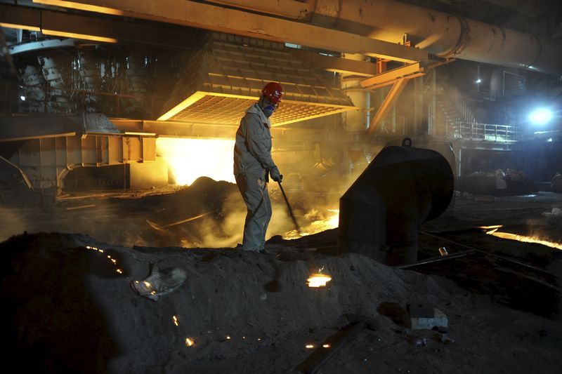 An employee works inside a steel factory in Kashgar, China March 10, 2013. u00e2u20acu201d Reuters pic
