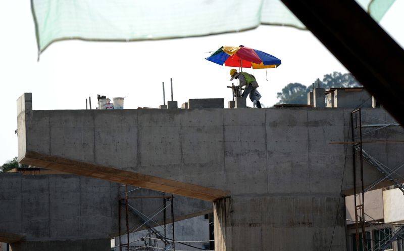 A worker shields himself from the hot sun while working at a construction site in Kuala Lumpur, April 9, 2016. u00e2u20acu2022 Bernama pic