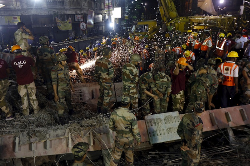 Firefighters, soldiers and rescue workers search for victims at the site of an under-construction flyover after it collapsed in Kolkata, India, March 31, 2016. u00e2u20acu201d Reuters pic