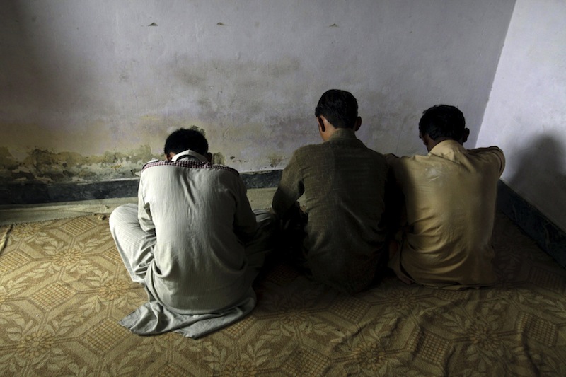 Children whose families say have been abused, turn their backs to the camera while they are interviewed by a Reuters correspondent in their village of Husain Khan Wala, Punjab province, Pakistan August 9, 2015. u00e2u20acu201d Reuters pic