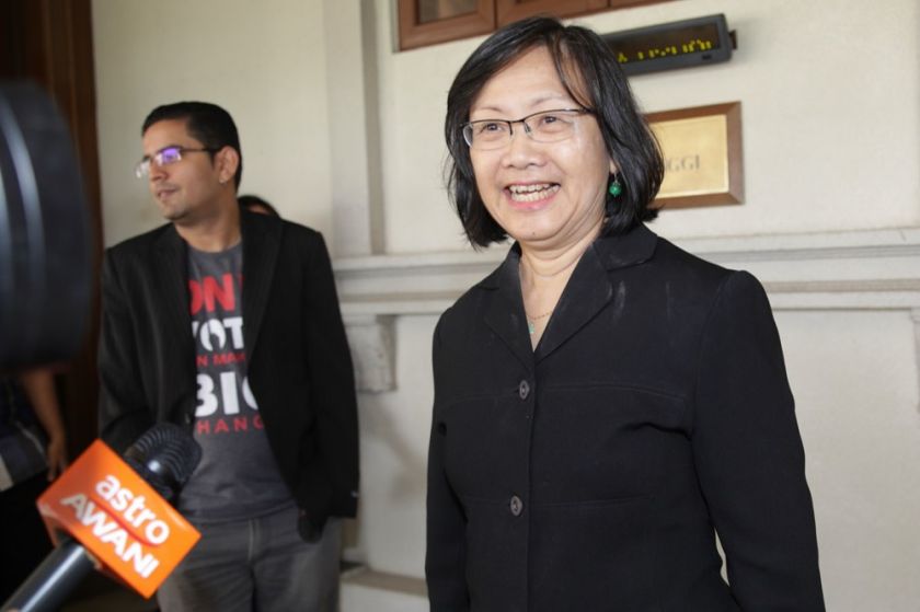 nMaria Chin Abdullah addresses members of the media after her challenge to strike out an illegal assembly charge today. u00e2u20acu201d Picture by Choo Choy Mayn