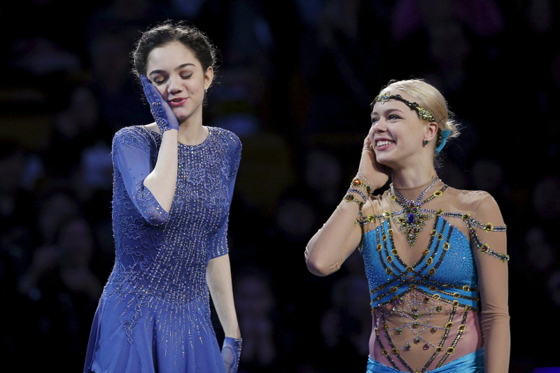 Gold medallist Evgenia Medvedeva of Russia (left) and bronze medallist Anna Pogorilaya of Russia greet each other at the awards podium at the ISU World Figure Skating Championships in Boston April 2, 2016. u00e2u20acu201d Reuters pic