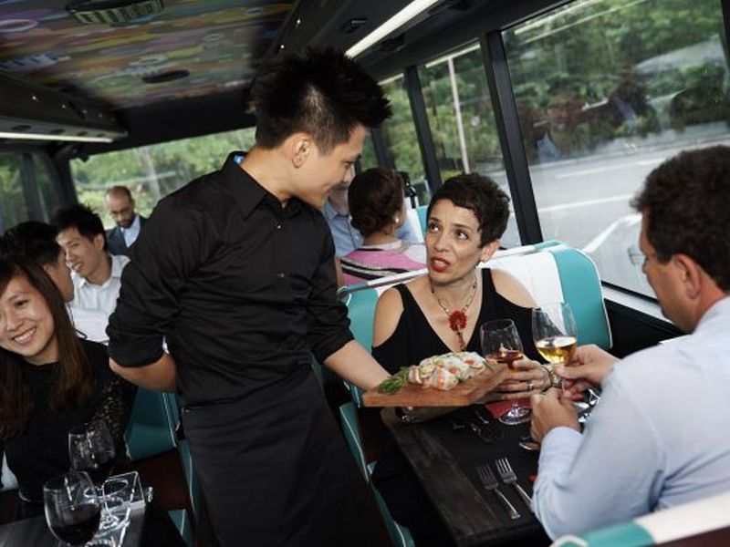 The food is plated on the lower deck before being served to diners on the upper deck.