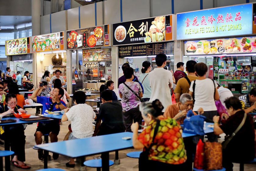 There are more than 14,000 licensed hawkers in 109 hawker centres managed by the National Environment Agency, of whom 6,000 sell cooked food. u00e2u20acu201d TODAY pic