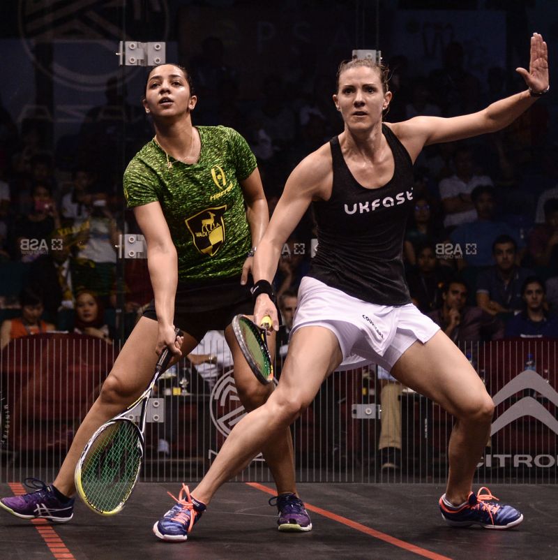 Laura Massaro of England (R) and Raneem El Welily of Egypt (L) eye the ball during their semi-final match of the PSA Womenu00e2u20acu2122s World Championships squash tournament in Bukit Jalil, outside Kuala Lumpur, April 29, 2016.MOHD RASFAN / AFP