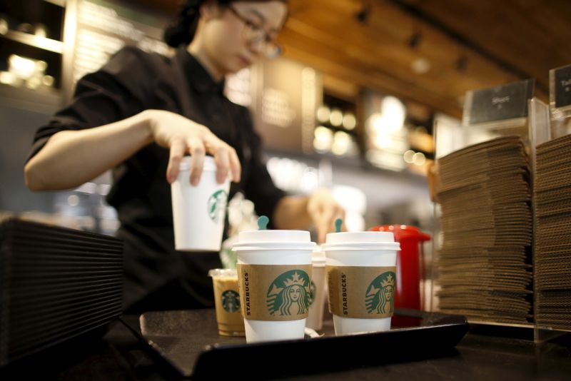 A staff serves beverages at a Starbucks coffee shop in Seoul, South Korea, March 7, 2016. u00e2u20acu2022 Reuters pic