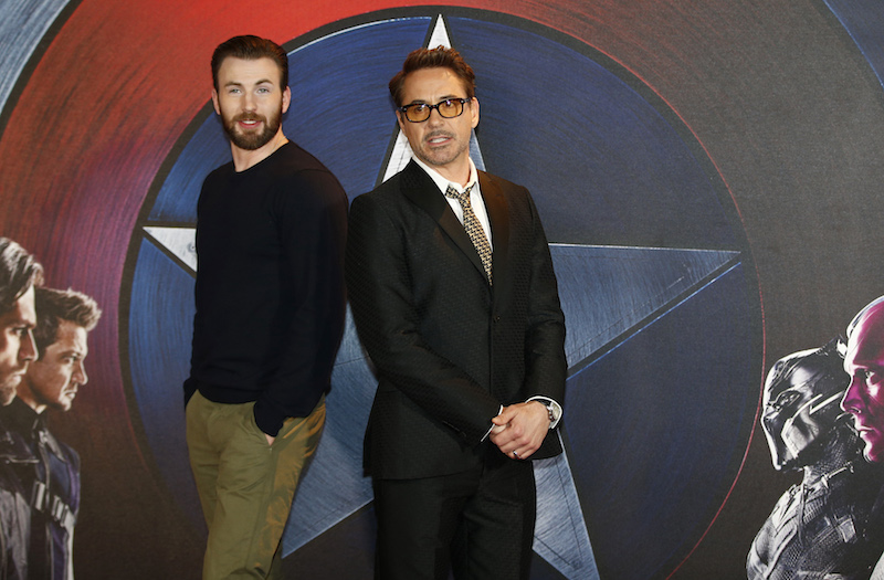 Chris Evans and Robert Downey Jr pose for photographers at a media event ahead of the release of ‘Captain America: Civil War’ in London April 25, 2016. — Reuters pic