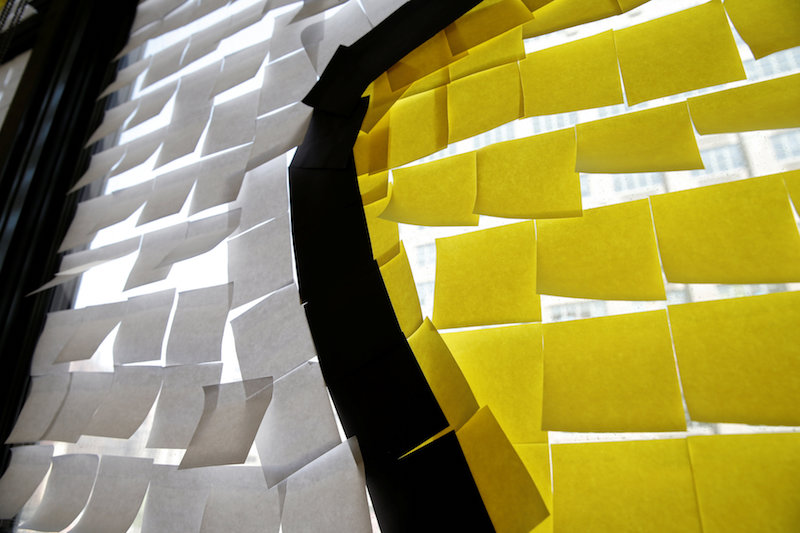 Part of an image crated with Post it notes is seen in a window at the offices of Havas Worldwide in lower Manhattan, New York, May 18, 2016. — Reuters pic