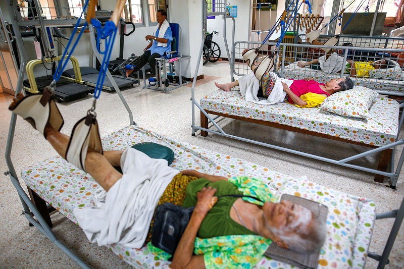 Elderly people lie in beds during a physical therapy session at Bangkhae Home Foundation in Bangkok, Thailand April 27, 2016. u00e2u20acu201d Reuters pic
