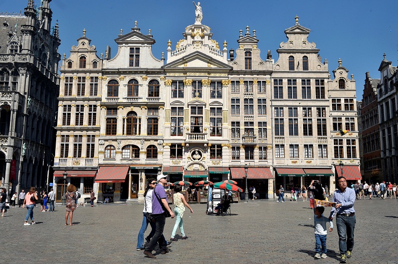 Tourists walk at the Grand Place during a hot and sunny day in Brussels, Belgium. Picture released May 9, 2016. u00e2u20acu201d Reuters pic