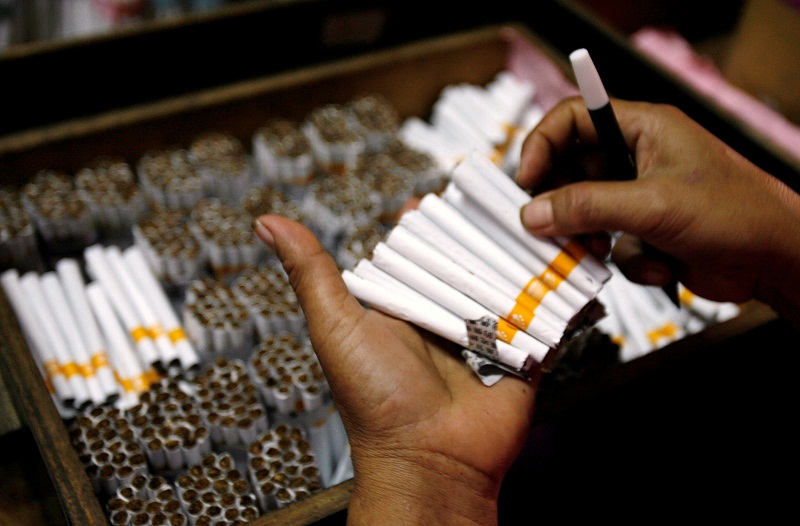 An employee counts cigarettes before packing them in Sidoarjo, Indonesiau00e2u20acu2122s East Java province April 7, 2010. u00e2u20acu201d Reuters pic