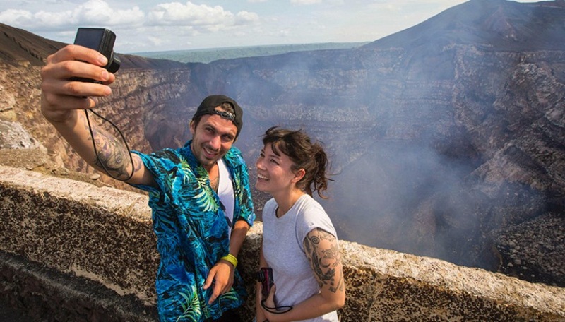 Tourists pose for a selfie at the crater of the Masaya Volcano in Masaya, some 30km from Managua on May 19, 2016. u00e2u20acu201d AFP pic