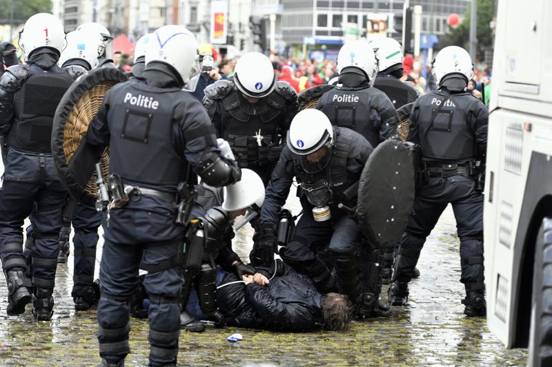 Belgiumu00e2u20acu2122s riot police arrest a demonstrator during a national anti-austerity demonstration on May 24, 2016, in Brussels. u00e2u20acu2022 AFP pic