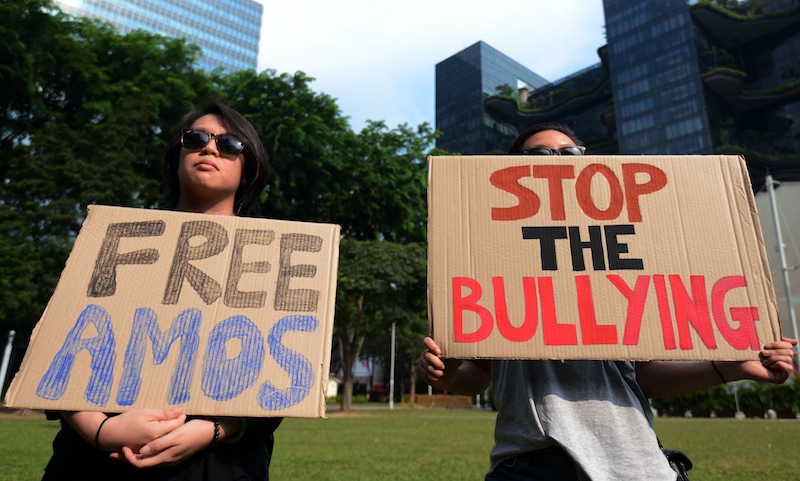 Member of the public hold up placards in support of 16-year-old Amos Yee who is behind online attacks on late former prime minister Lee Kuan Yew in Singapore on July 5, 2015. u00e2u20acu201d AFP pic