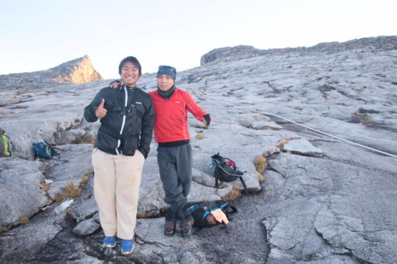 Khunakorn Kocharint, 21, (left) feels indebted to late mountain guide Robbi Sapinggi for saving his life during the June 5 earthquake last year. u00e2u20acu2022 Picture courtesy of Amazing Borneo