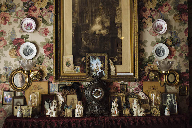 A mantel covered with memorabilia at Dennis Severs’ House, a tourist attraction in London April 29, 2016. Visitors to the museum tiptoe through rooms that are immaculately dressed in the sights, sounds and — yes — the smells of bygone ages, right down to the curls of lemon-peel next to still-steaming cups of tea. — Picture by David Azia/The New York Times