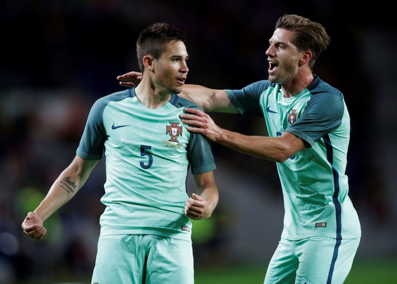 Portugal's Raphael Guerreiro (left) celebrates his goal against Norway with his team mate Adrien Silva. u00e2u20acu201d Reuters pic
