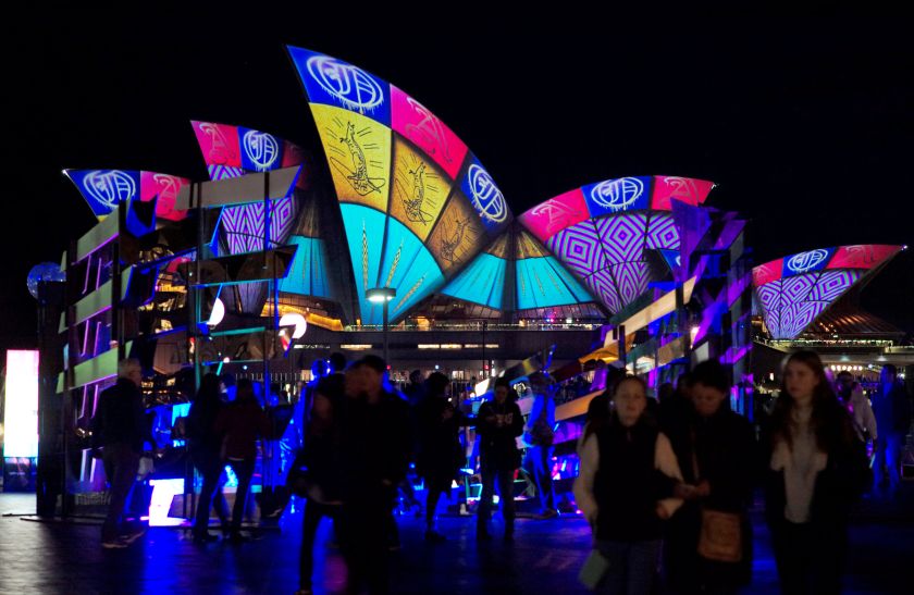 Visitors walk among a glowing fluorescent sculpture as a light show is projected onto the Sydney Opera House on the second night of the annual Vivid Sydney light festival in Sydney, Australia, May 28, 2016. u00e2u20acu201d Reuters pic