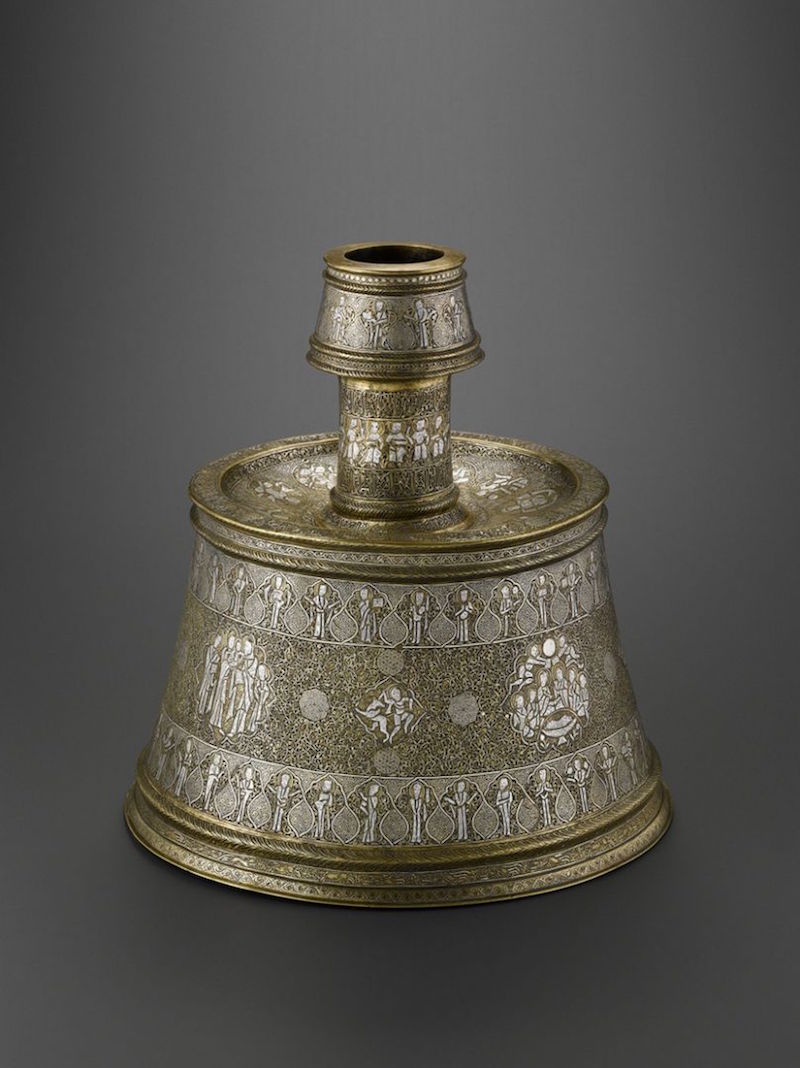 This candlestick, which was made in Syria, mixes Christian scenes with subjects more typical of medieval Islamic art, such as the signs of the zodiac (on the upper surface of the base) and a frieze of animals (along the lower edge of the base). — Handout via TODAY
