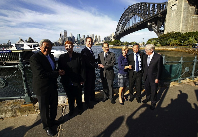 Julie Bishop (third from right)  with Dr Vivian Balakrishnan (second from right) after they disembarked a ferry on Sydney Harbour on March 18, 2016. u00e2u20acu201d File pic