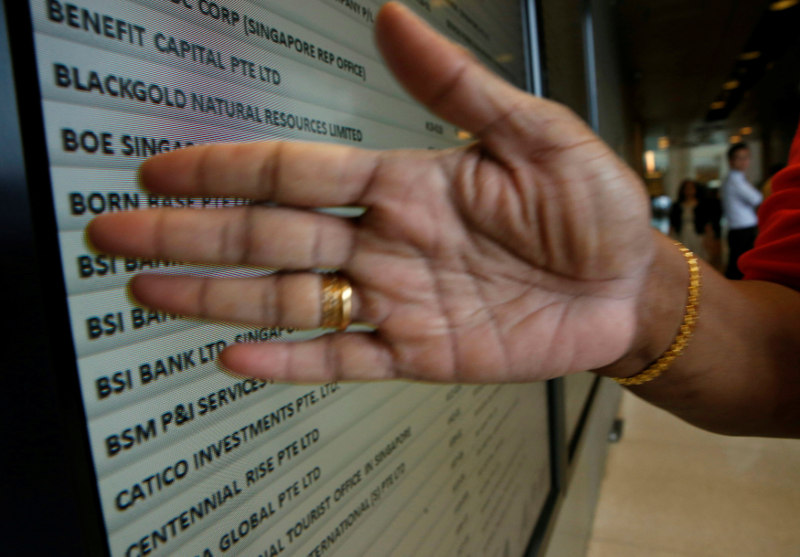 A security officer blocks a directory board showing Swiss bank BSI at their office building in Singapore May 24, 2016. u00e2u20acu201d Reuters pic