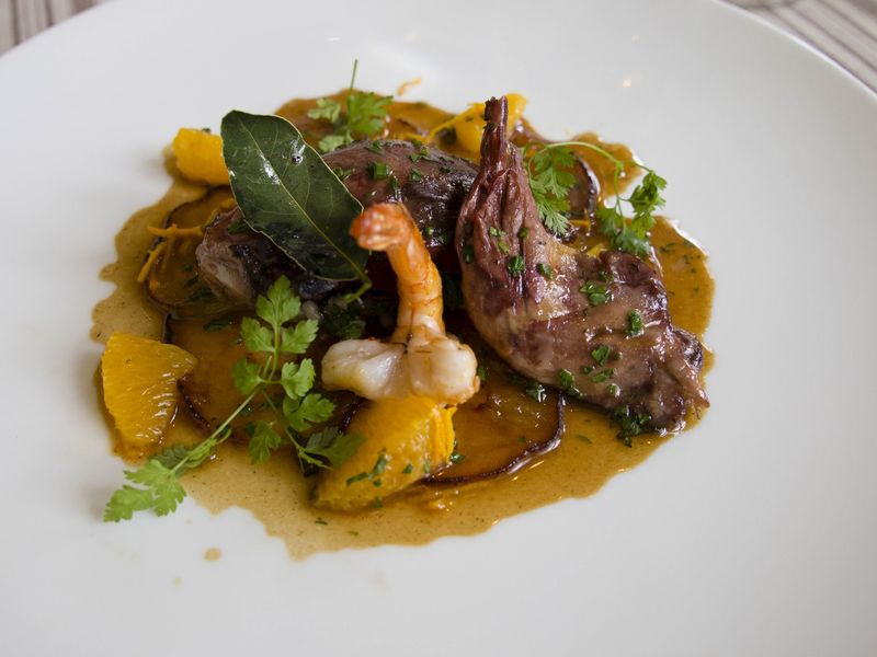Pigeon is cooked with shrimp, bay leaf and tangerine. — Picture by Carla Capalbo 