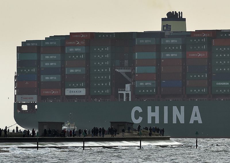 Onlookers watch from a harbour wall as the largest container ship in world, CSCL Globe, docks during its maiden voyage, at the port of Felixstowe in south east England, January 7, 2015. u00e2u20acu201d Reuters pic