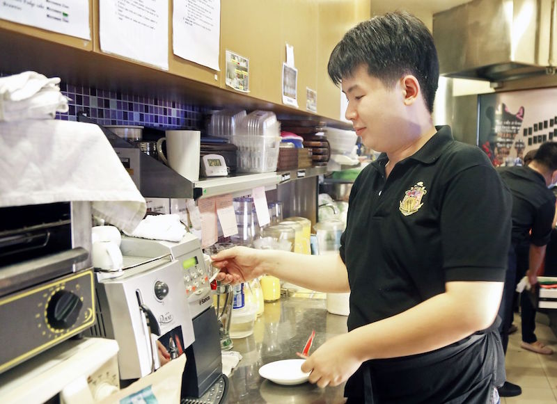 Low Quan Jing, who has autism, has been a staff member at Professor Brawn Cafe, since December 2009. — TODAY pic