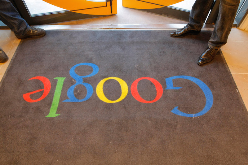A Google carpet is seen at the entrance of the new headquarters of Google France before its official inauguration in Paris, France December 6, 2011. REUTERS/Jacques Brinon/Pool/File Photon