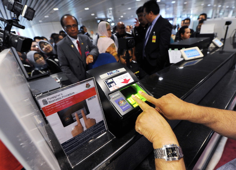 File picture shows the biometric fingerprint scanner being used for security screening at the immigration counter in Kuala Lumpur International Airport (KLIA), May 17, 2016. u00e2u20acu201d Bernama pic