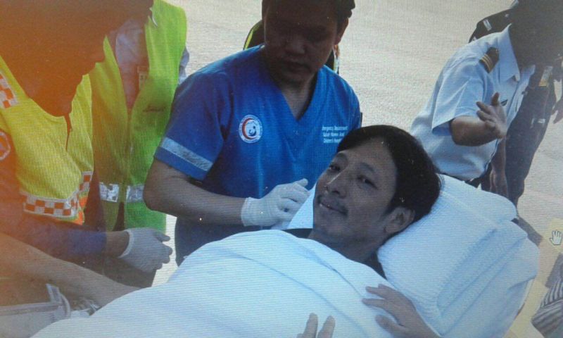 Resort owner Tommy Lam smiling to family members upon arrival at the Kota Kinabalu International Airport today. It is his 44th birthday today.