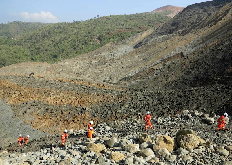 Rescue workers are pictured at the site of a landslide on December 26, 2015 in Hpakant, Kachin State, the war-torn area that is the epicentre of Myanmar's secretive billion dollar jade industry.u00c2u00a0u00e2u20acu201d AFP pic