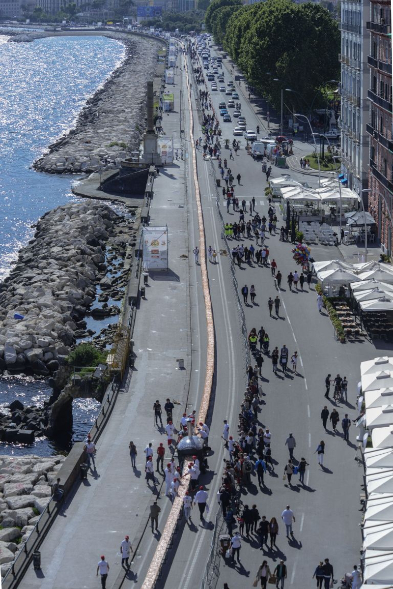 Naples has reclaimed the world record for the longest pizza with this mile-long (1.6km-long) magherita. u00e2u20acu201d AFP pic