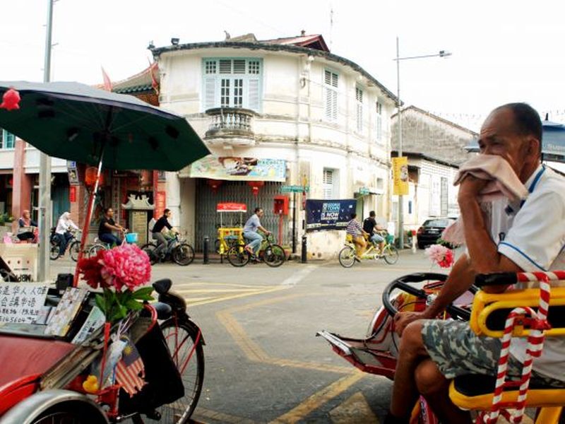 The junction of Lebuh Armenian and Lebuh Cannon in Penang. Some residents complain that the price of living is rising and islanders are finding themselves more often than not sitting in traffic jams. u00e2u20acu2022 Picture by Looi Sue Chern