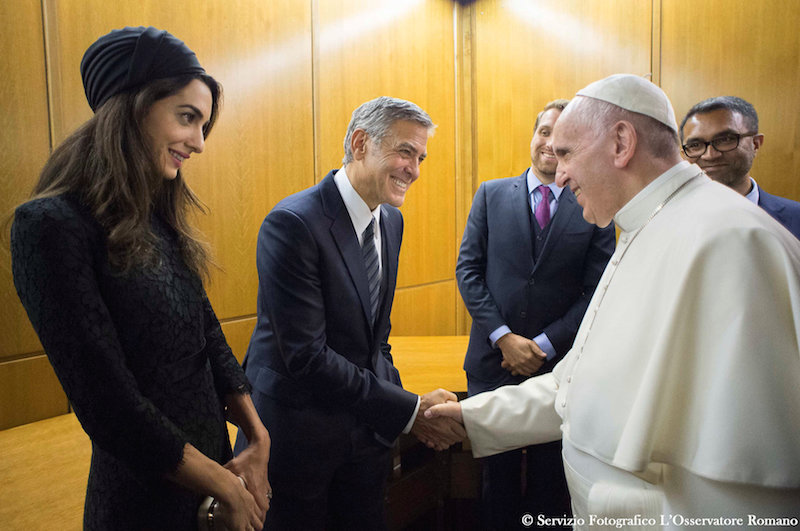 Pope Francis meets USactor George Clooney (centre) and his wife Amal (left) during a meeting of the Scholas Occurrentes at the Vatican, May 29, 2016. u00e2u20acu201d Reuters pic