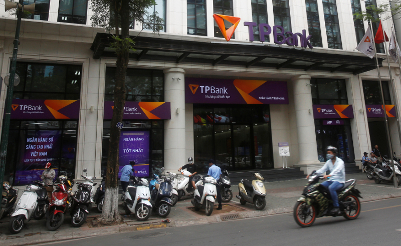 A man rides a motorcycle past the Vietnamese commercial Tien Phong bank in Hanoi May 13, 2016. u00e2u20acu201d Reuters pic