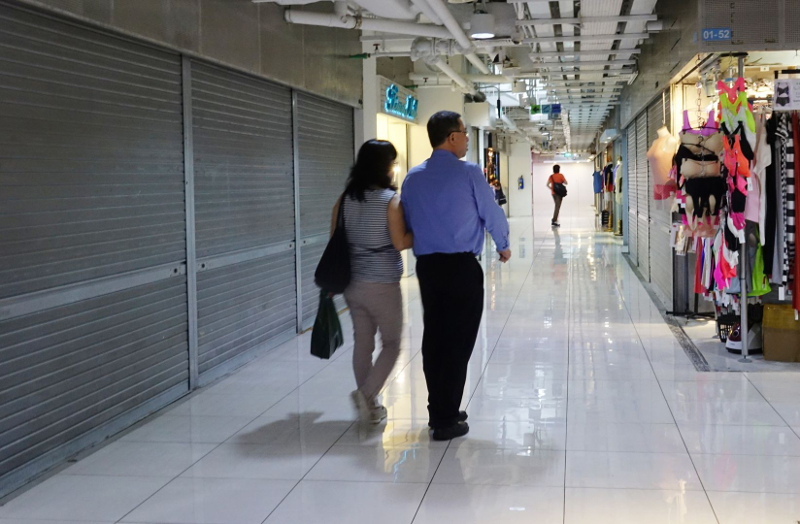 Shuttered units at the basement of Far East Plaza on a weekday evening.