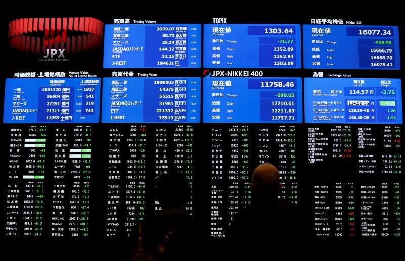 Visitors looks at an electronic board showing the Japan's Nikkei average (top right) at the Tokyo Stock Exchange (TSE) February 9, 2016. The Topix was little changed on May 19 morning after rising earlier. u00e2u20acu201d Reuters pic 