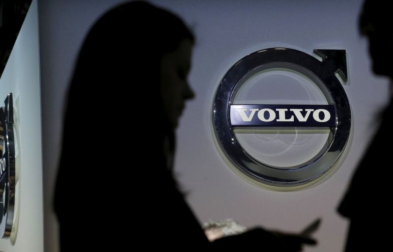 People are seen in silhouette near the Volvo auto stand during the media preview of the 2016 New York International Auto Show in Manhattan, New York March 24, 2016. u00e2u20acu2022 Reuters pic