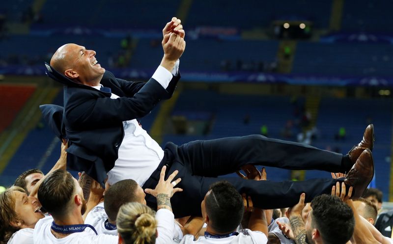 Real Madrid players give coach Zinedine Zidane the bumps as they celebrate winning the Uefa Champions League in Milan May 28, 2016. u00e2u20acu201d Reuters pic