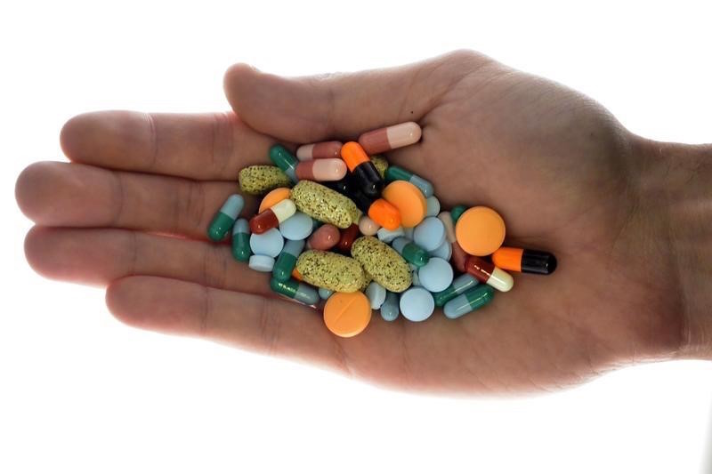 A person holds pharmaceutical tablets and capsules in this picture illustration taken in Ljubljana September 18, 2013. u00e2u20acu201d Reuters pic