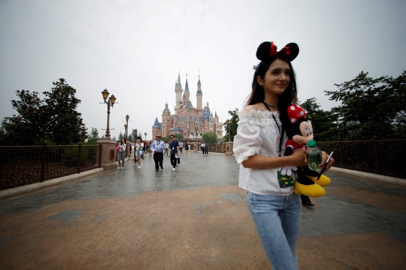 People walk at Shanghai Disney Resort during a three-day Grand Opening event in Shanghai June 15, 2016. u00e2u20acu201d Reuters pic