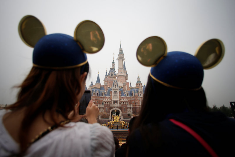 Women wearing Mickey Mouse ears watch the opening ceremony at Shanghai Disney Resort in Shanghai June 16, 2016. u00e2u20acu201d Reuters pic