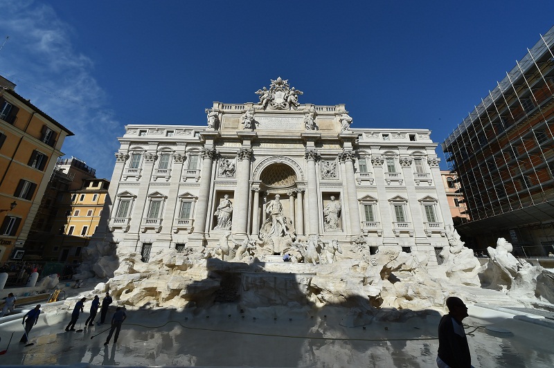 Workers clean the restored Trevi fountain prior its inauguration on November 3, 2015 in central Rome. u00e2u20acu201dAFP pic
