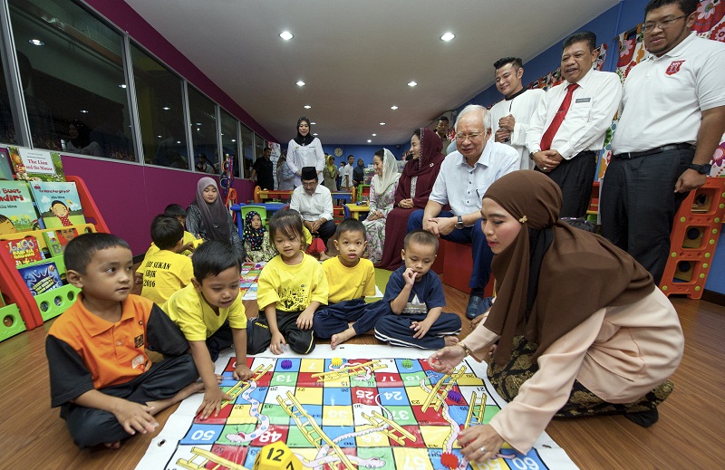 Prime Minister Datuk Seri Najib  Razak (seated, second from right) and his wife Datin Seri Rosmah Mansor (seated, third from right) during a visit to Sekolah Bimbingan Jalinan Kasih, in Kuala Lumpur June 17, 2016. u00e2u20acu201d Bernama pic