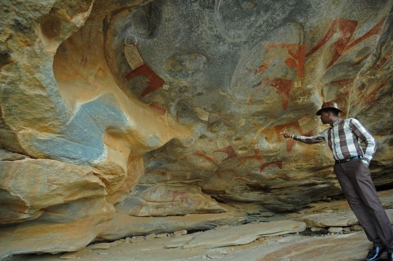 This file photo taken on May 17, 2016 shows a primitive rock painting, one of a galaxy of colourful animal and human sketches to adorn the caves in the rocky hills of this arid wilderness in northern Somalia, near Hargeisa, home to Africau00e2u20acu2122s earliest kno