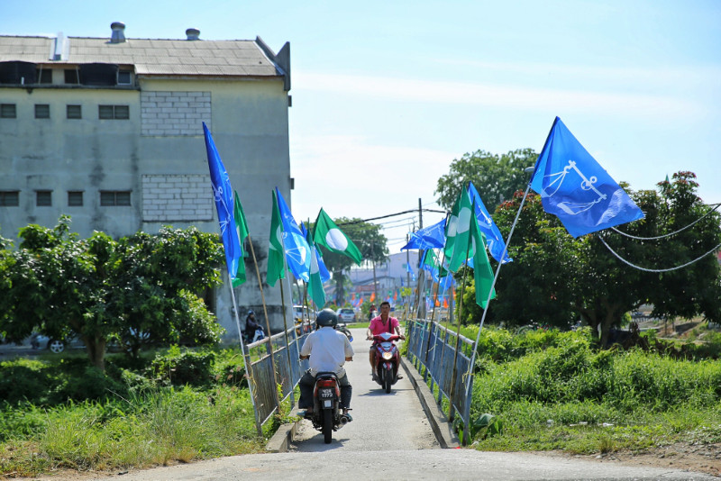 Motorcyclists crossing the river via a narrow bridge in Sungei Besar, Selangor, June 11, 2016. u00e2u20acu201d Picture by Saw Siow Feng
