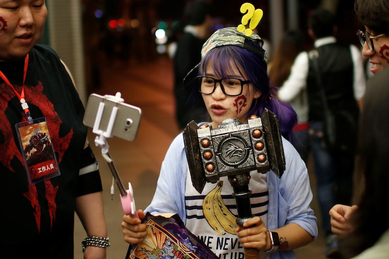 A fan livestreams her participation during China's premiere of the film 'Warcraft' at a theatre in Shanghai, China June 7, 2016. u00e2u20acu201d Reuters pic