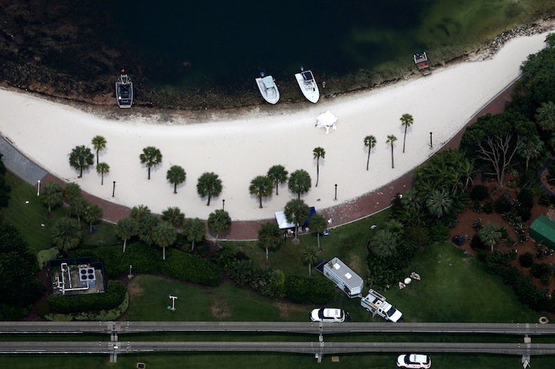 Rescue boats, tents and police vehicles are seen along the shoreline at the Walt Disney World resort in Orlando, Florida June 15, 2016. u00e2u20acu201d Reuters pic